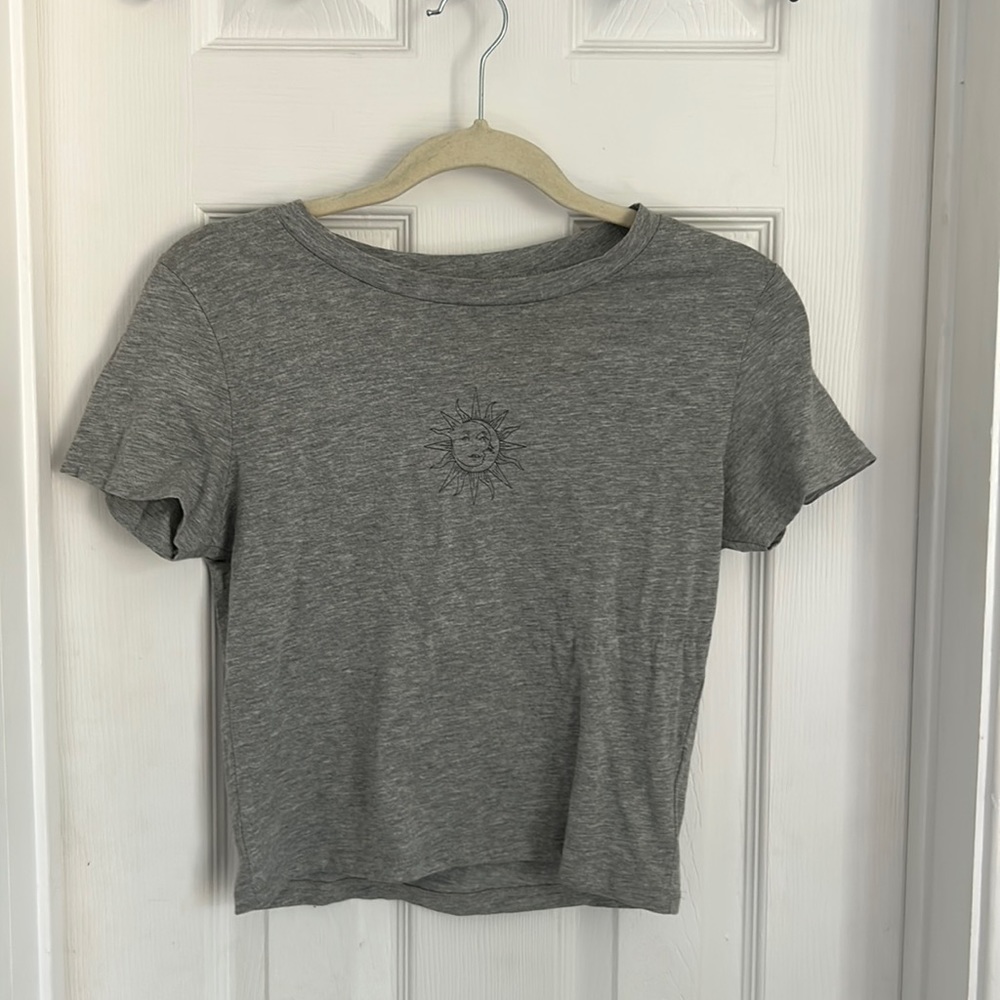 Charlotte Russe grey crop top with sun logo on it mostly new only worn twice